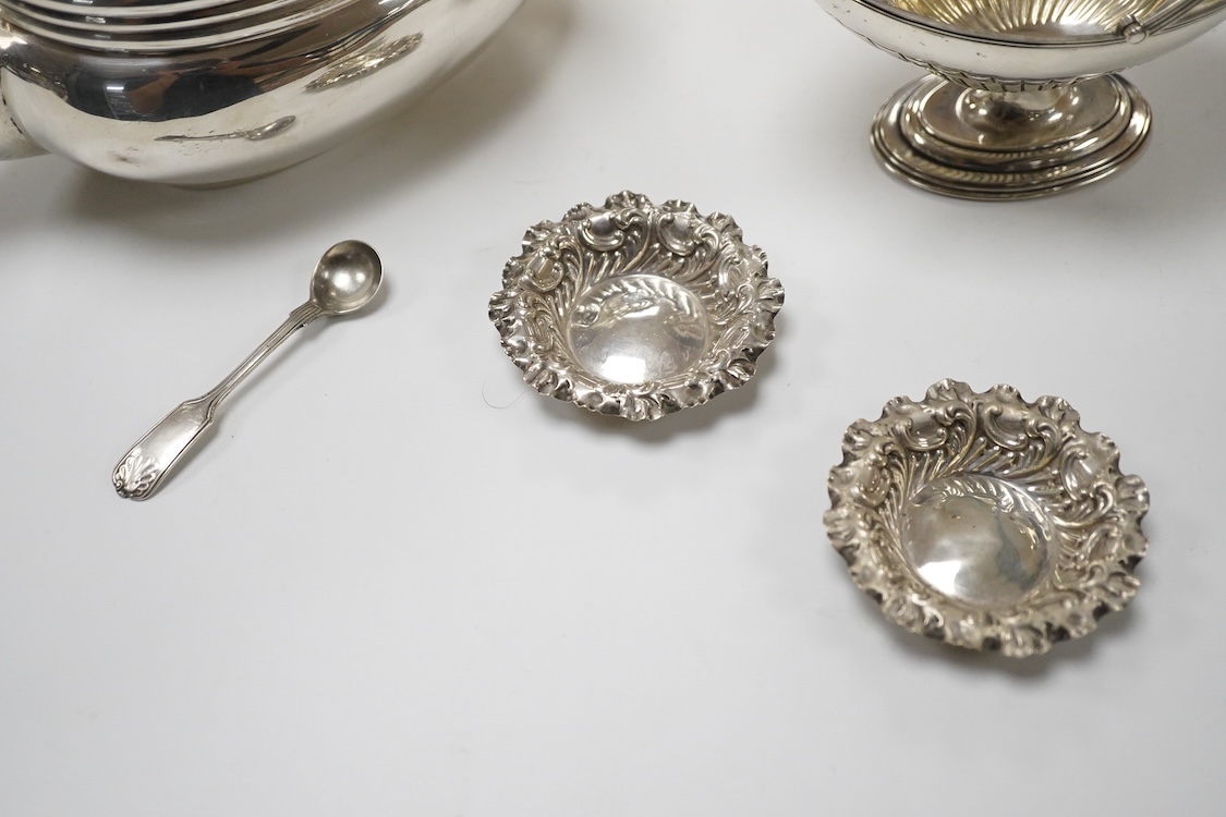 A late Victorian silver boat shaped sugar basket, by Thomas Bradbury & Sons, London, 1896, length 13.2cm, together with a pair of late Victorian repousse silver nut dishes and a silver condiment spoon. 4.8oz.